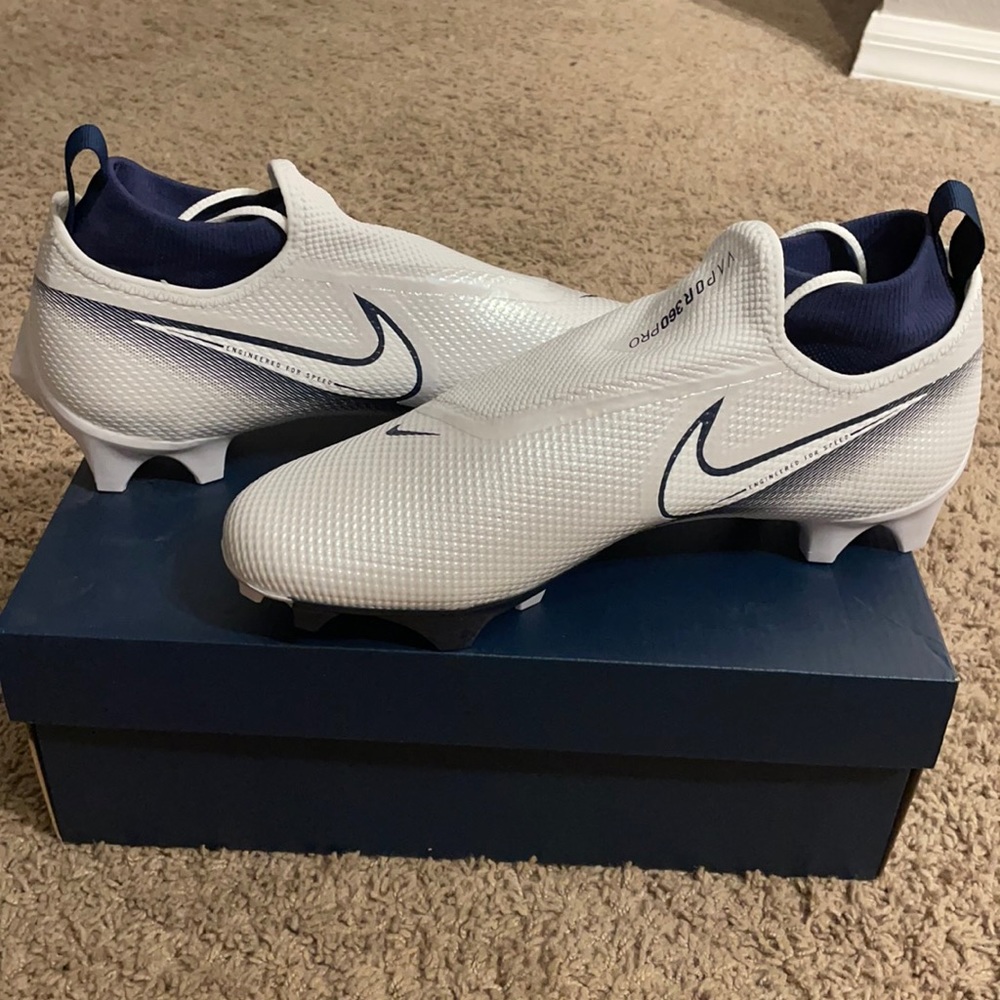 Brand new, never worn, Nike Vapor 360 Pro football cleats. White with Navy.